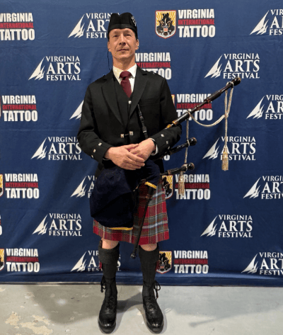 Kendall Giles holding bagpipes